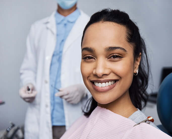smiling woman sitting in a dental chair