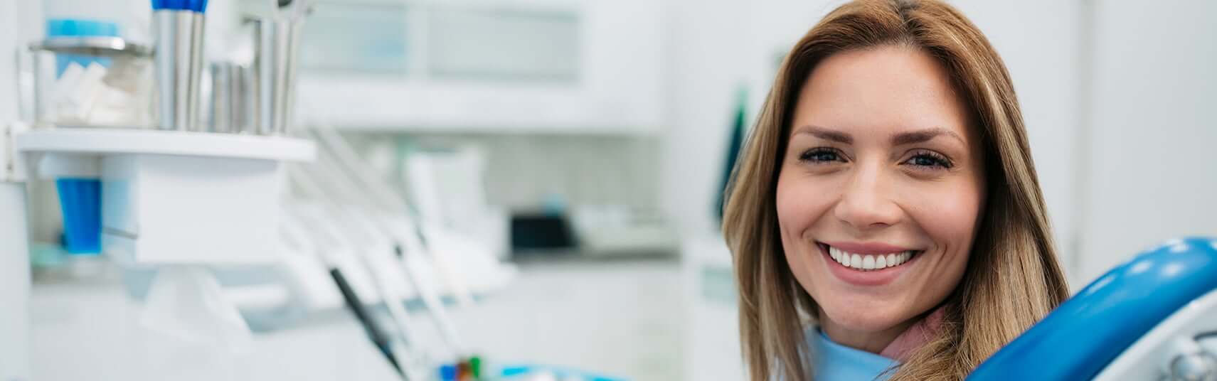 smiling woman sitting in a dental chair