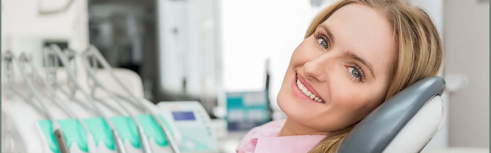 smiling woman sitting in a dental chair