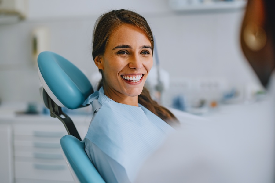 woman learning more about cavitation surgery at mckinney holistic dentist office