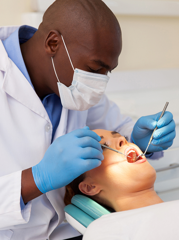 Dentist examining a patient's teeth